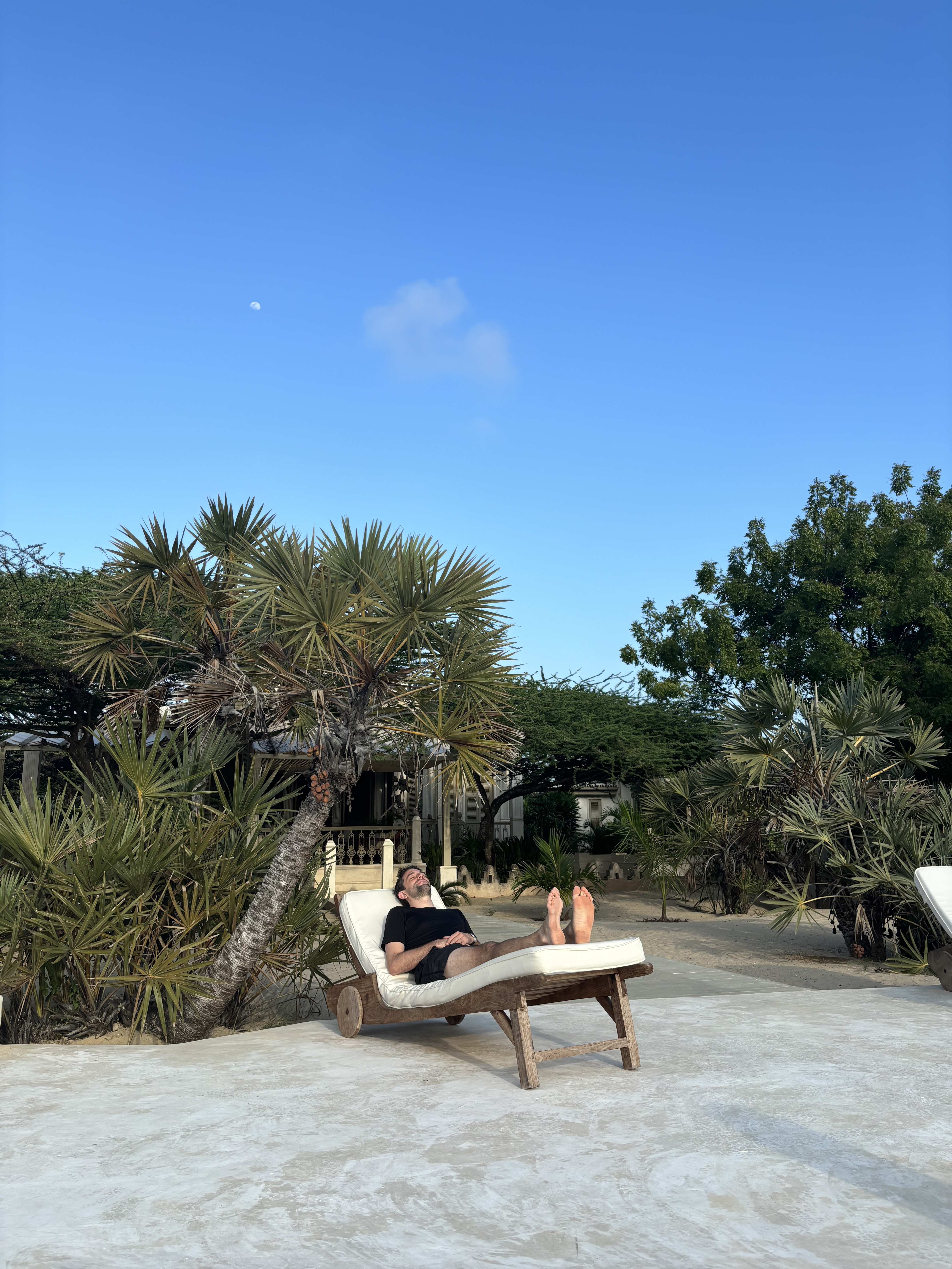 cutest baby jordan holds up his hands. he is wearing garden gloves